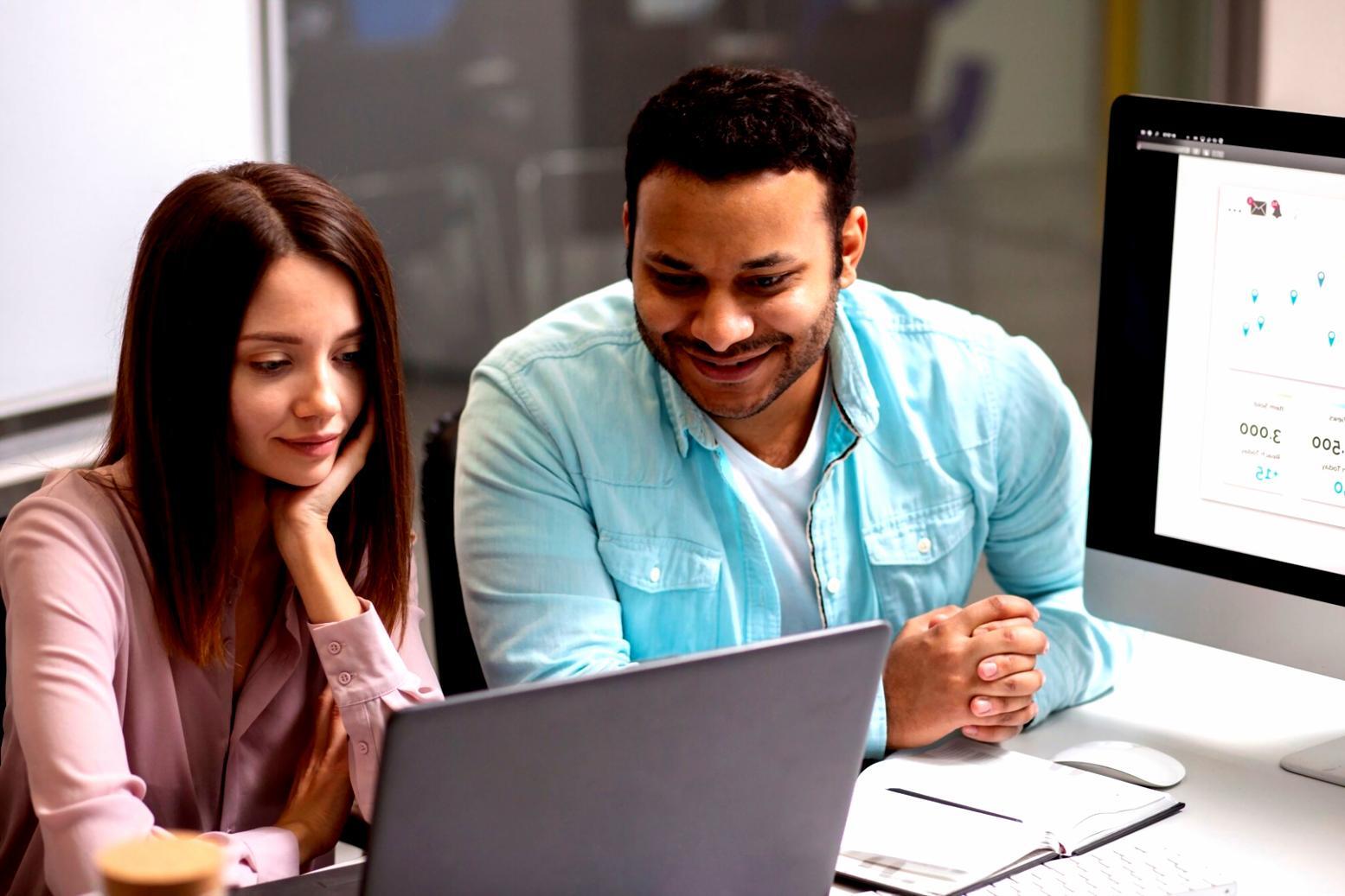 Business compliance documents and regulatory paperwork spread across desk